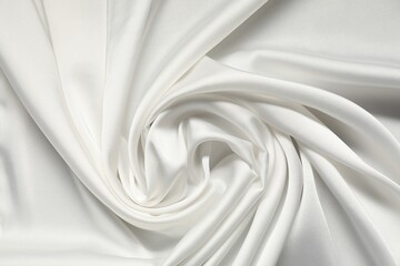 White crumpled silk fabric as background, top view