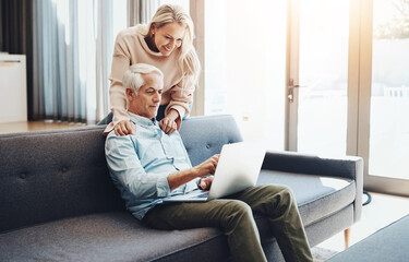 Laptop, internet and mature couple on couch with asset management research, planning and investment...