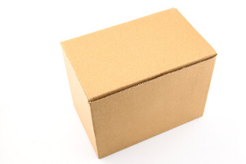 plain brown cardboard box without inscriptions and logos isolated on white background close-up