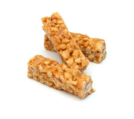 Honey bars with peanuts, sesame and sunflower seeds isolated