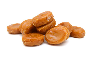 Caramel candies isolated on white background