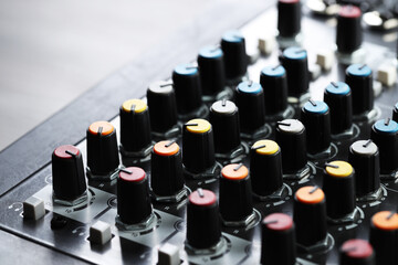 Professional mixing console on table, closeup. Radio studio equipment