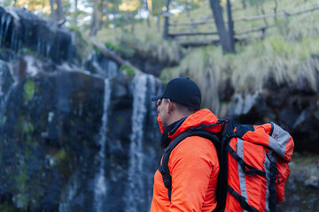 Hiker contemplating apatlaco waterfalls in izta-popo national park
