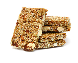 Honey bars with peanuts, sesame and sunflower seeds isolated