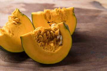 Japanese pumpkin or kabocha on wooden background, Fresh vegetable, Food ingredient