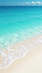 Obraz premium Soft white sand beach with gentle blue ocean waves, landscape, water