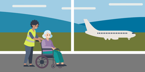 Airport staffer wearing a yellow high-visibility vest assisting old lady in a wheelchair. Airport wheelchair assistance concept