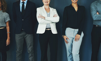 Business people, arms crossed and hands by wall in team, row and together with solidarity in modern...