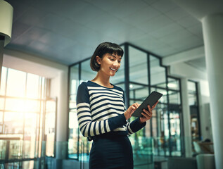 Tablet, smile and business woman reading email, news update and research for information online....
