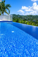Infinity pool overlooking lush tropical landscape