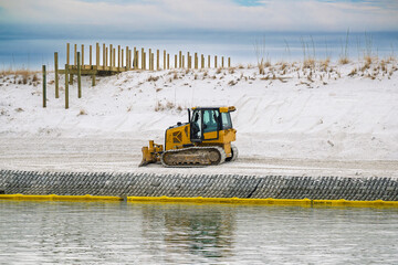 Beach renourishment Destin Florida bulldozer white sand