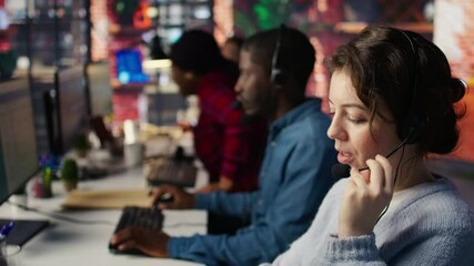 Call center employee handling customer inquiries, complaints and support requests in office. Customer service representative assisting customers with issues related to products or services, camera B