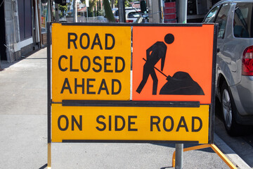 Road sign road closed ahead on side road