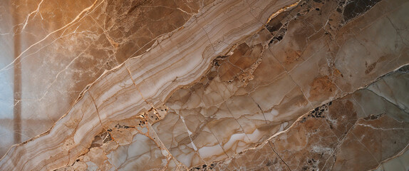 High-resolution brown and beige marble surface with wavy layered veins and natural stone textures for design backgrounds  
