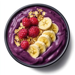 Acai bowl fruit, granola, berries, and banana slices in a black bowl