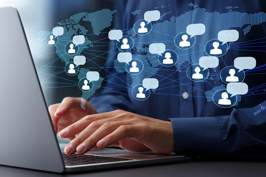Global remote collaboration and international teamwork. International collaboration network. Businessman using laptop computer to communicate with team.