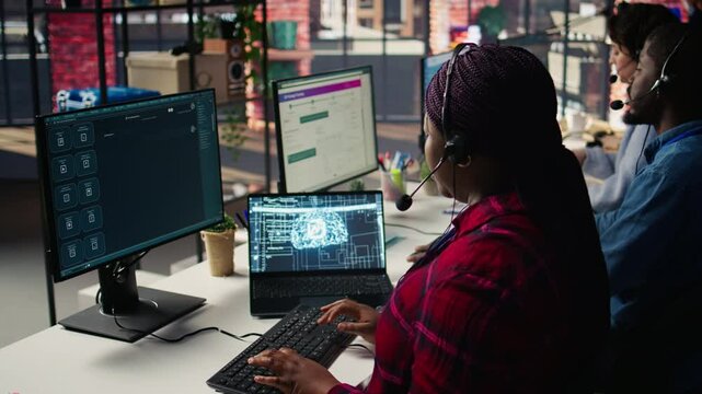 Call center employee using AI chatbot at office desk to reply to common customer queries, close up. Customer service staff member at work generates automated responses to clients using AI, camera B