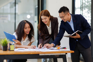 Group of confident business people point to graphs and charts to analyze market data, balance sheet, account, net profit to plan new sales strategies to increase production capacity.	
