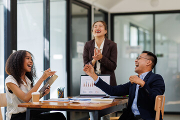 Group of  businesspeople or team creative businesspeople coworker in office Happy to be successful partnership teamwork celebrating achievement and success concept.
