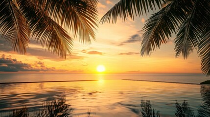 Fototapeta premium Beachside infinity pool reflecting the sunset with palm trees framing a perfect tropical evening.