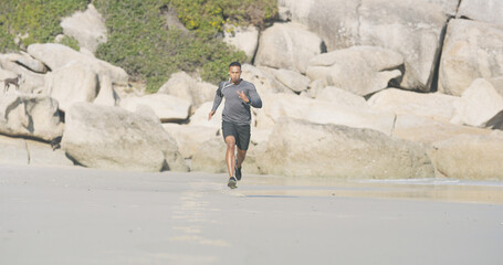 Beach, man and portrait with running for fitness, exercise and sprinter with pace for wellness...