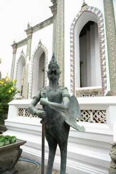 Bronze Kinnari statue in The Emerald Buddha or Wat Phra Kaew.
