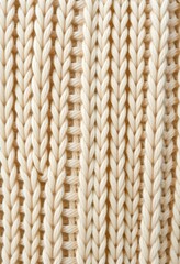 Knitted texture, cream-colored yarn, close-up, vertical ribbing pattern, soft wool fabric, intricate stitches, cozy winter sweater detail, warm beige tones, textured background