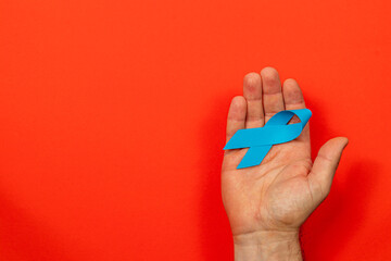 Fototapeta premium Promoting awareness for cancer prevention through symbolic blue ribbon