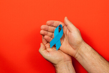 Support for cancer awareness with blue ribbon symbolizing hope and care
