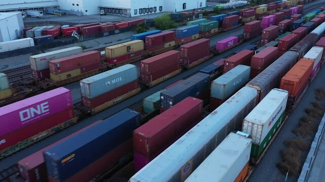 Carson, California, USA - April 2, 2025: An inter-modal stack freight train loaded with containers passes towards the port of Los Angeles.