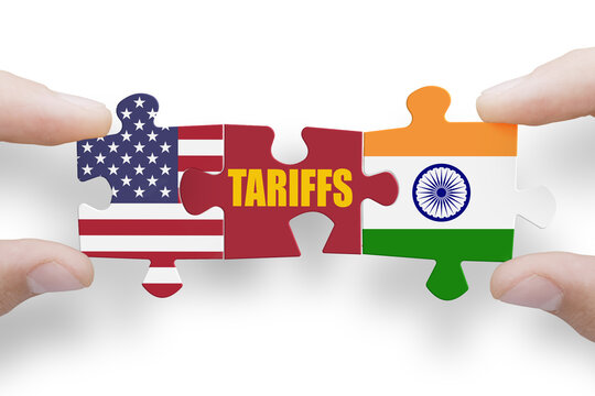 Puzzle made from United States of America and India flags with word TARIFFS
