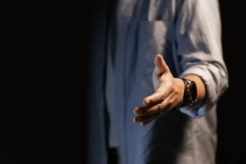 Businessman reaching out to shake hands, offer or welcome, recruitment and deal or thank you, introduction in meeting, support and greeting at job interview. 