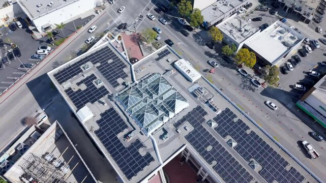Rows Of Solar Panels Creating Sustainable Energy On The Rooftop Of A Building, Arc Aerial Shot.