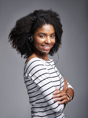Fototapeta premium Call center, arms crossed or portrait of proud black woman in studio with headset, smile or customer service. Faq, confident bilingual agent or communication for advice or support on grey background