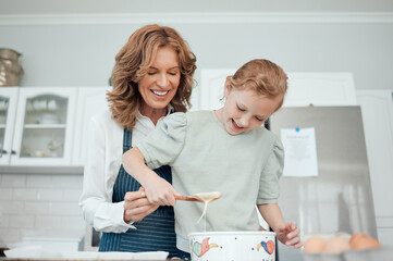 Grandmother, teaching and girl baker for learning in kitchen, house or home for pastry or mixing...