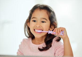 Child, brushing teeth or mirror in bathroom for dental care, hygiene or back to school in home....
