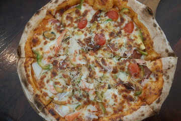 Delicious seafood pizza on table, top view. 