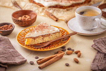 Homemade gluten free almond and cinnamon cake with cup of coffee