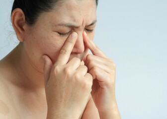 Woman face with sinusitis or sinus pain, health concept