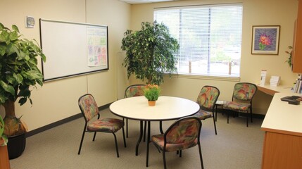 A clean and professional meeting space featuring a small round table, stylish office chairs, and a whiteboard.