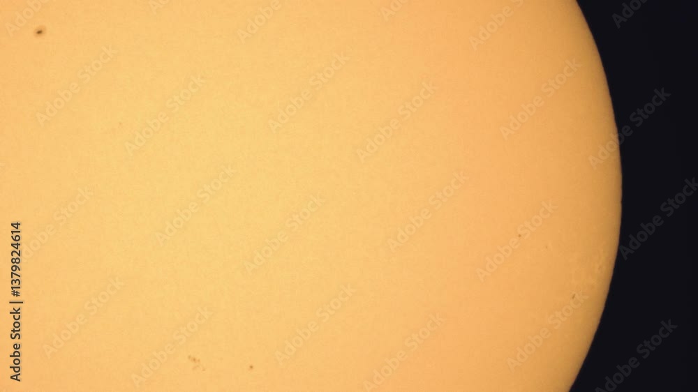 Poster surface of the sun through telescope with visible sunspots and surface texture and atmosphere turbul