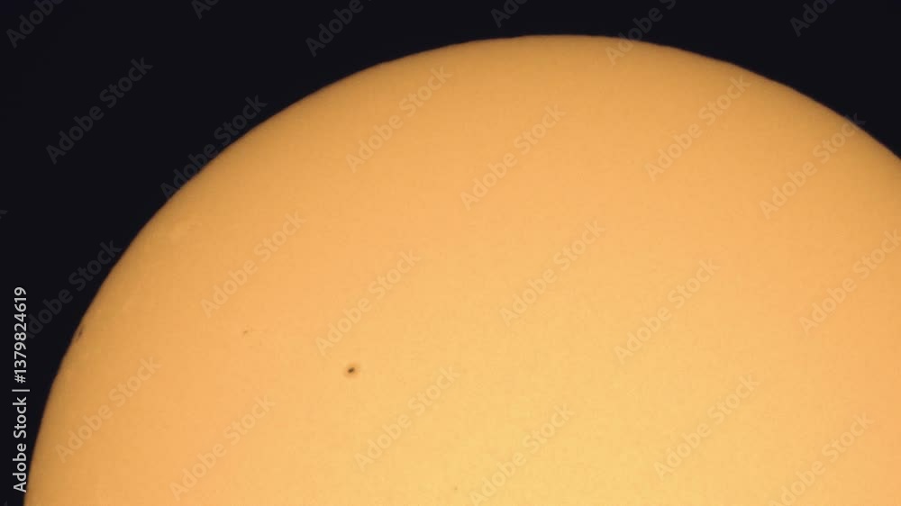 Poster surface of the sun through telescope with visible sunspots and surface texture and atmosphere turbul