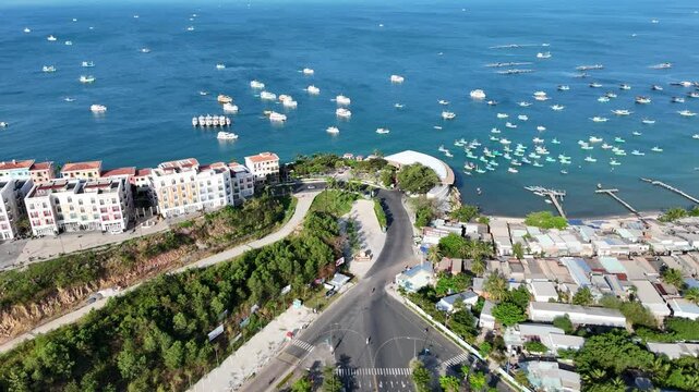 Aerial footage of Ki&ecirc;n Giang Phu Quoc Island, Vietnam. Shows Sunset Town's beautiful Mediterranean setting, and a picturesque harbor filled with a variety of boats and elegant yachts. Drone Video