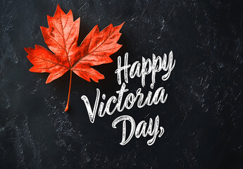vibrant red maple leaf alongside text Happy Victoria Day, creating festive and celebratory atmosphere
