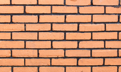 A brick wall with a tan color
