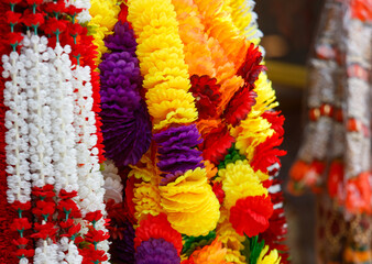 A bunch of colorful garlands are hanging together