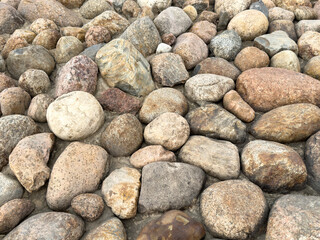 Stone background. Pebble stones texture. Multi-colored stones background