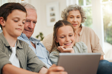 Boy, girl and grandparents on sofa with tablet for gaming, subscription or visit in home together....