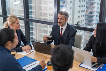 Business people or team with laptop in office for meeting,Multicultural professional businesspeople working together on research plan in boardroom.