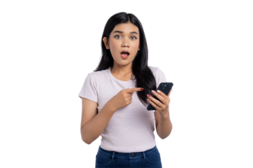 Surprised young Asian woman pointing at smartphone screen with shocked expression, reacting to unexpected news or message, isolated on transparent background
